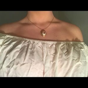 Gold necklace with rose print